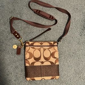 Coach brown signature stripe crossbody.